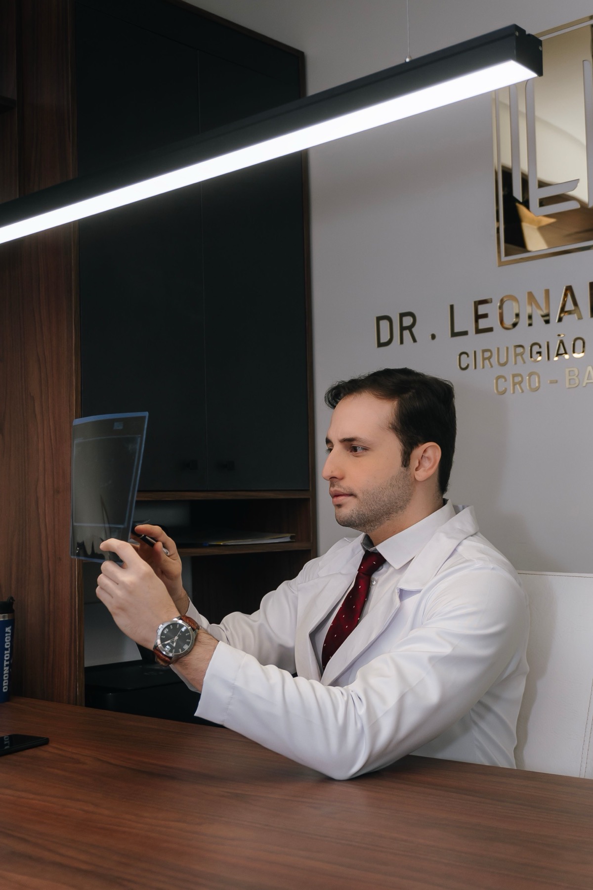Physician reviewing a medical X-ray during diagnostic work
