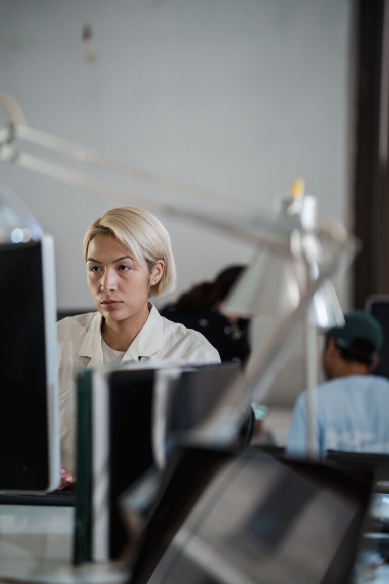 Professional concentrating on computer work in a modern office