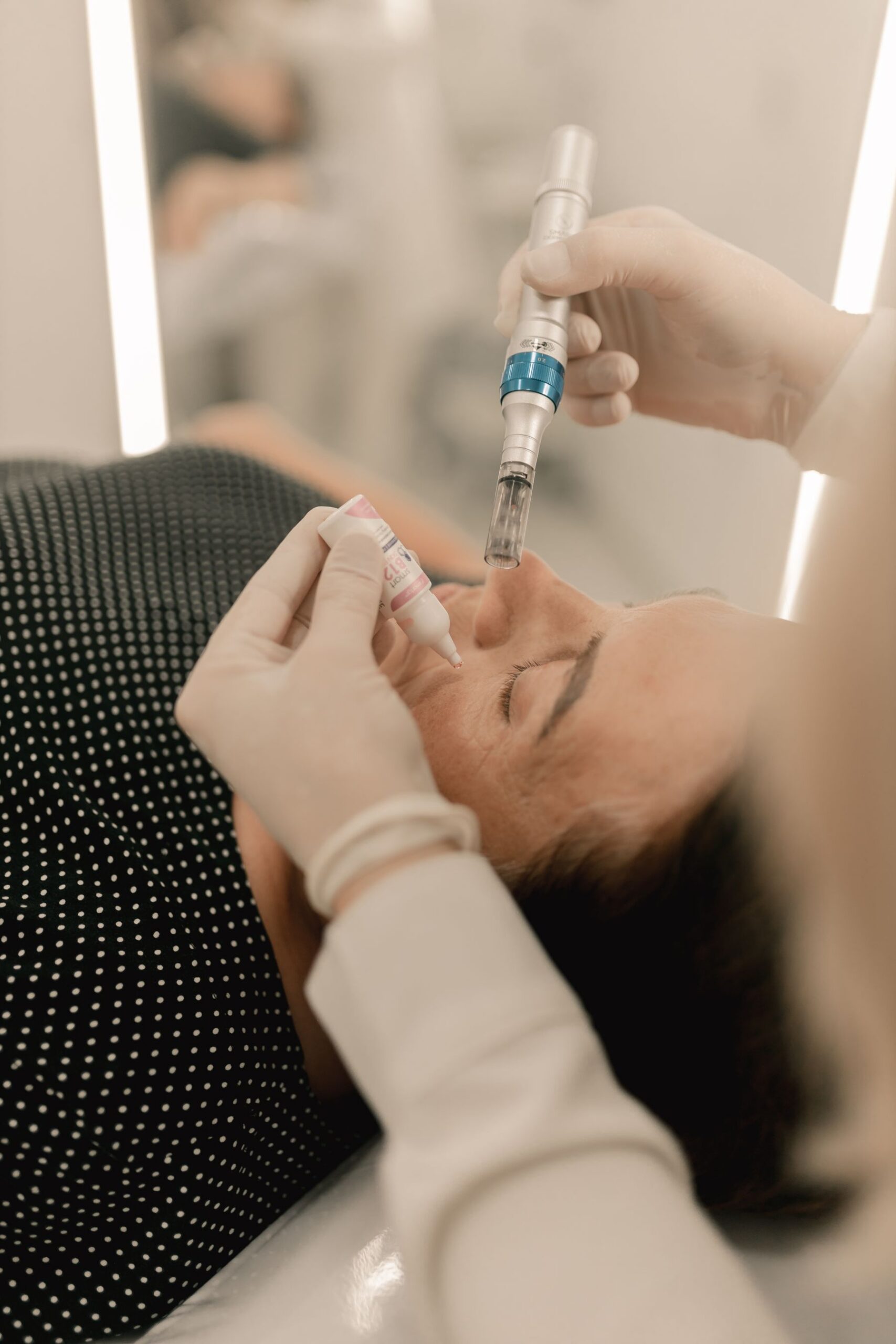 Clinician performing a microneedling facial treatment