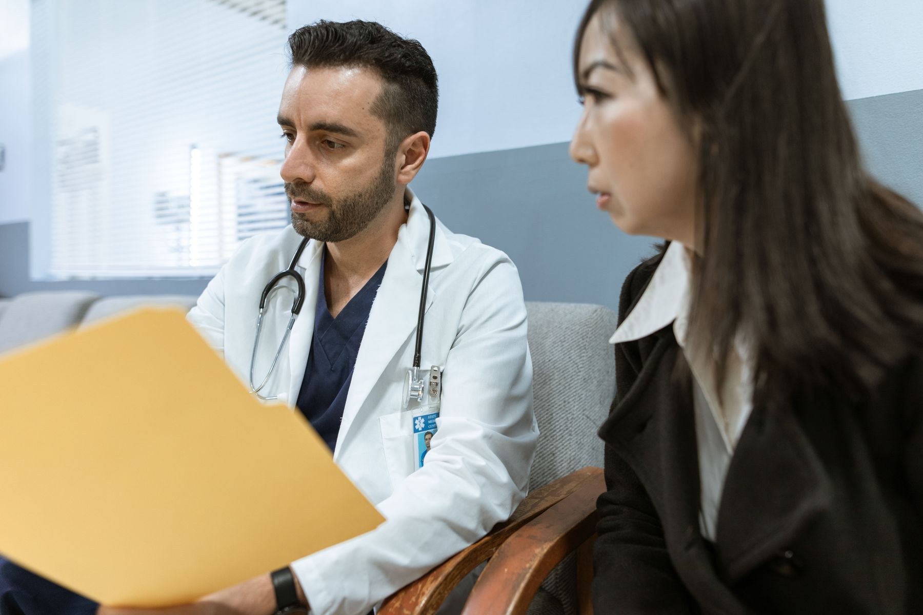 Doctor reviewing a treatment plan with a patient during a medical consultation
