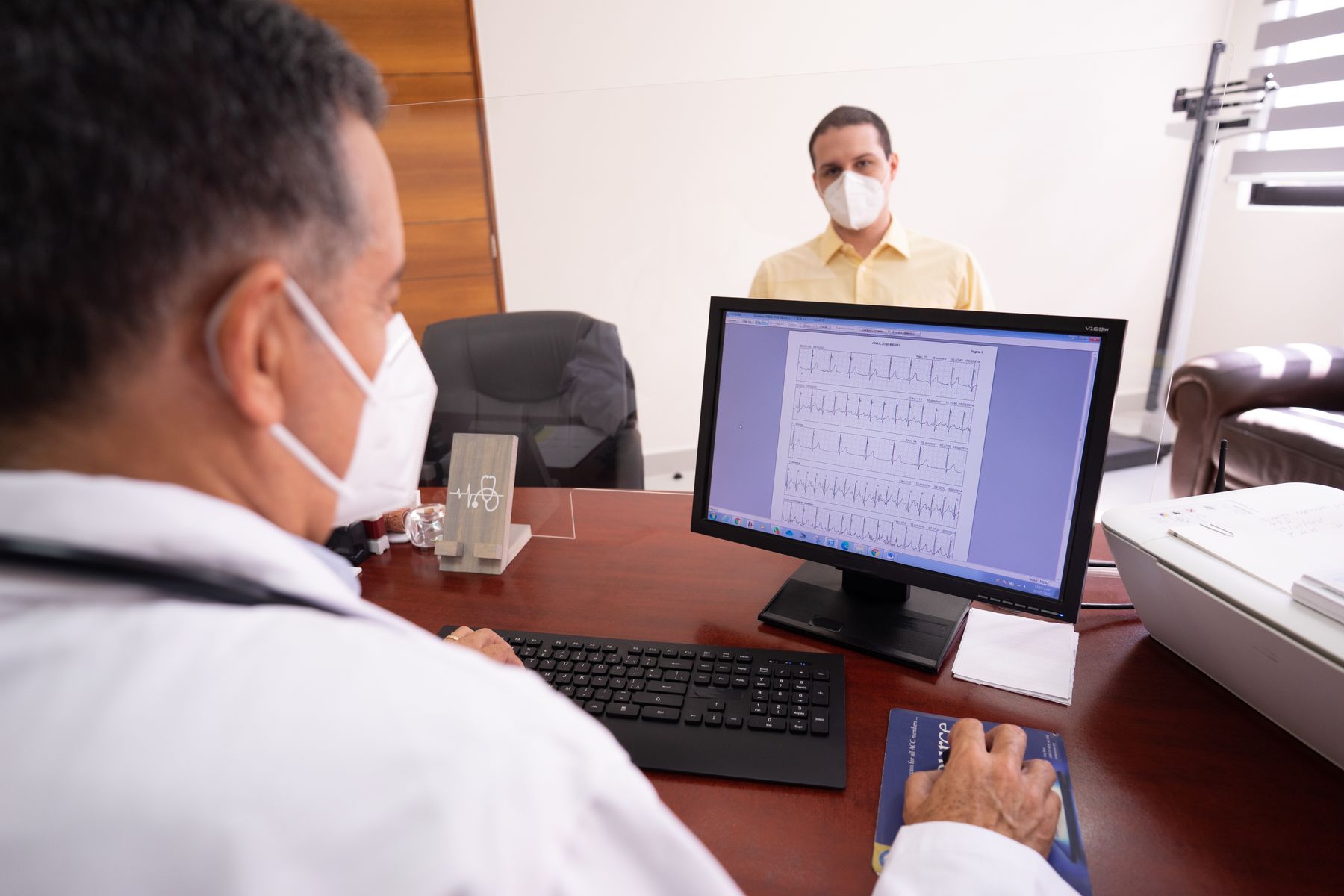 Man attending a preventive health visit with a physician