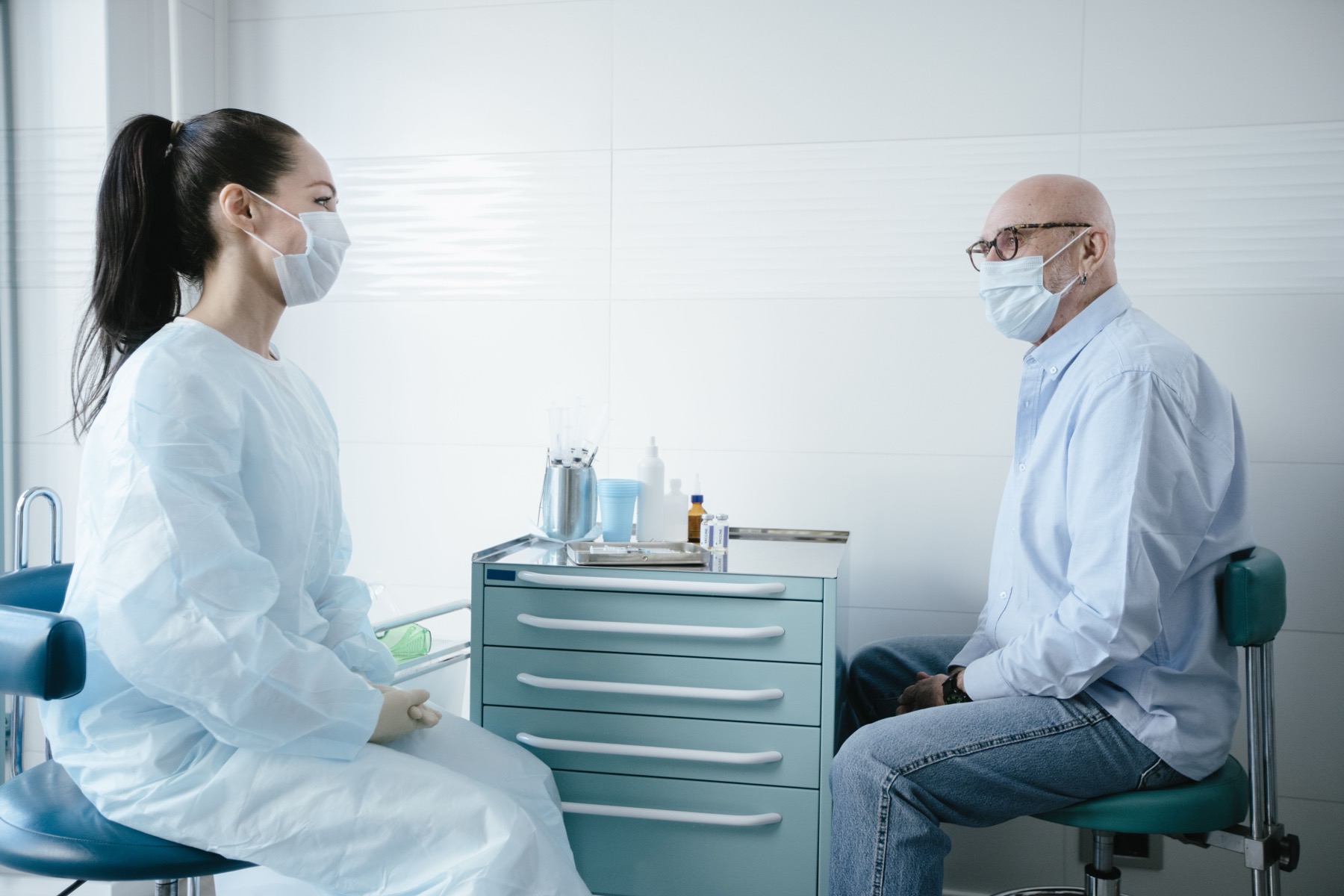 Older male patient discussing health concerns with a clinician