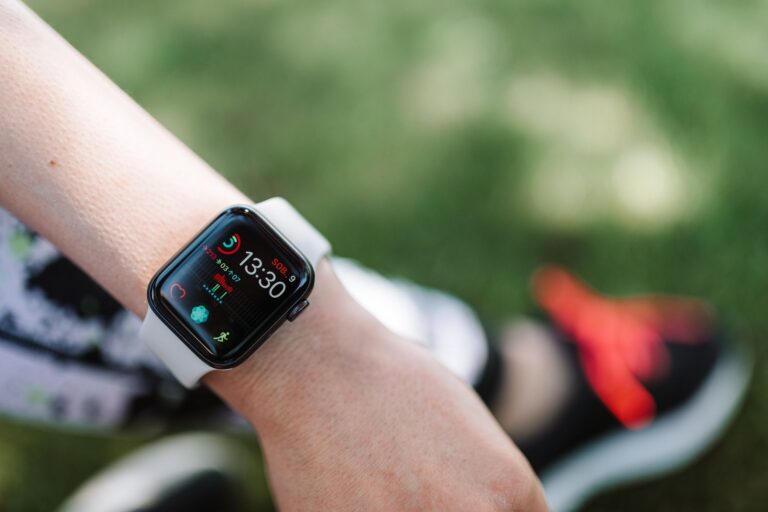 Smartwatch displaying health and activity data outdoors